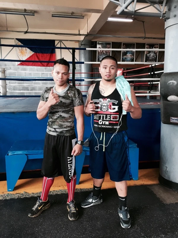 Two young Battlefit boxers standing together by the boxing ring