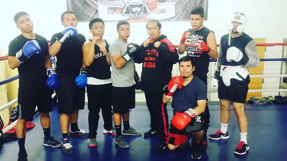 Young Battlefit boxers with their coach